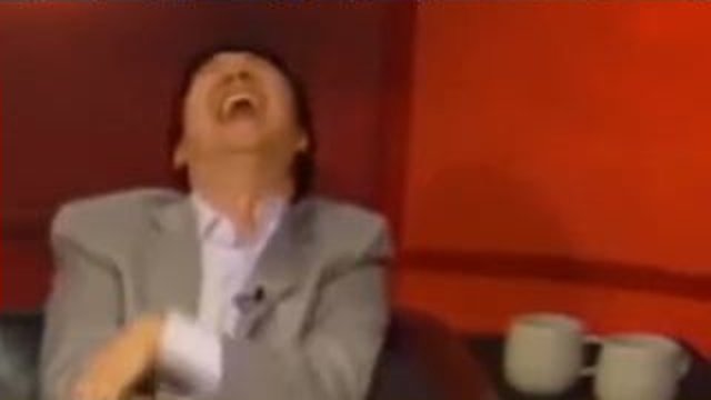 man laughing hard